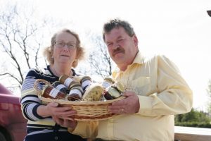 HOME PRODUCE: Courine and Ciaran Henderson with a hamper of their own homeproduced goods. Picture by Alan Finn 